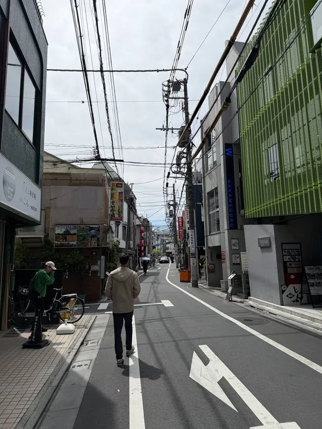 A quiet street in Nakameguro, Tokyo, under tangled power lines