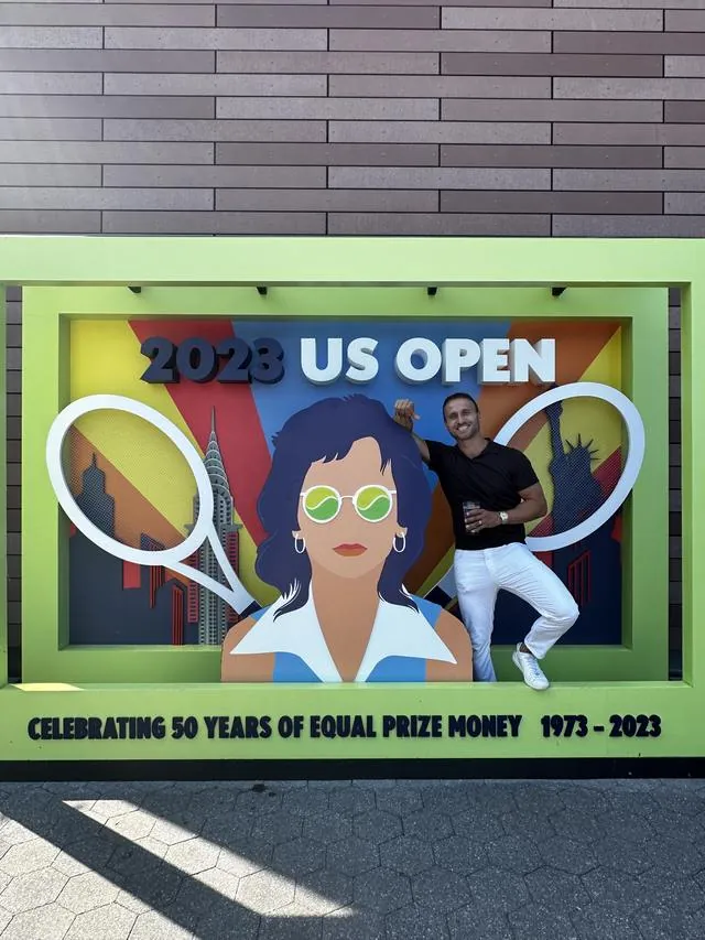Me beside a US Open mural marking fifty years of equal prize money